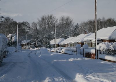 A view of a local street covered in snow
