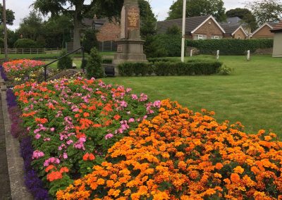 Pretty flowers in the foreground of the Messingham War Memorial