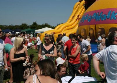 Visitors to Messingham Show by a bouncy castle