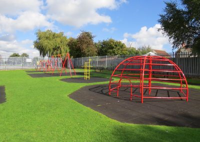Children's play area with swings and climbing frames