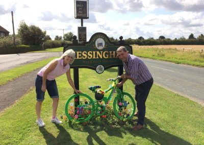 A bike decorated for the Tour of Britain by the Messingham road sign