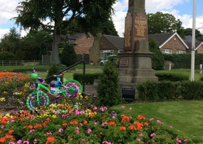 A bike decorated for the Tour of Britain in the Messingham memorial garden